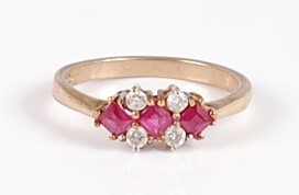 Lot 325 - A 9ct gold, ruby and diamond set dress ring, 2....