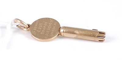 Lot 332 - A yellow metal commemorative gold key,...
