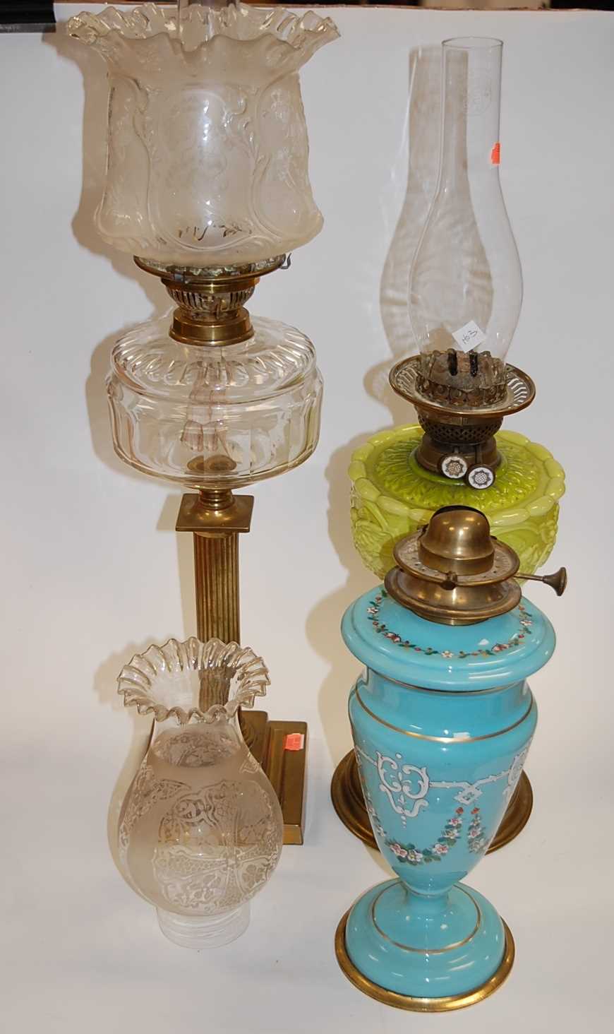 Lot 124 - A Victorian oil lamp having a frilled glass...