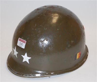 Lot 242 - An American WWII pattern steel helmet, with...