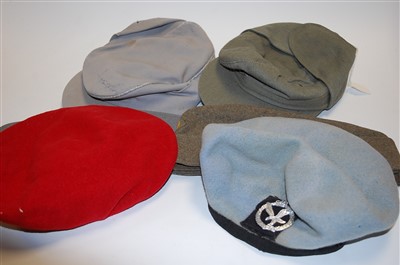 Lot 243 - A collection of military headgear, to include...