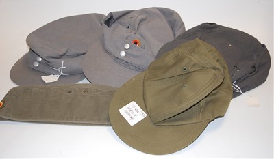 Lot 250 - A collection of military headwear, mainly...