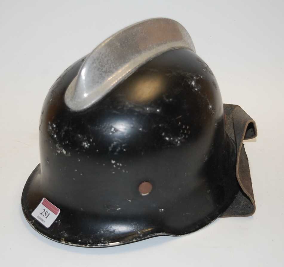 Lot 251 - A Belgian/French Adrian helmet, painted black...