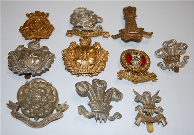 Lot 274 - A collection of assorted cap badges and...