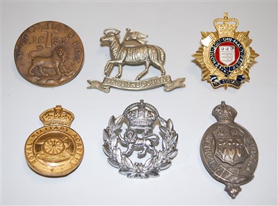 Lot 277 - A small collection of military badges and...