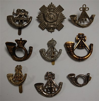Lot 279 - A collection of assorted military cap badges...