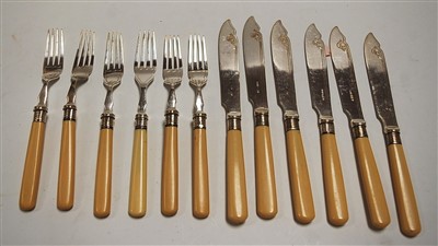 Lot 298 - A set of six silver plated fish knives and...