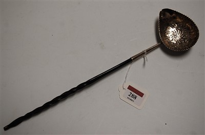 Lot 288 - A George III silver toddy ladle, the bowl...