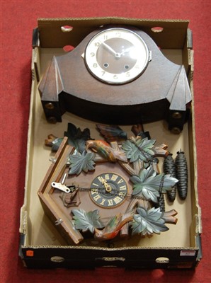 Lot 67 - A modern cuckoo clock; together with an oak...
