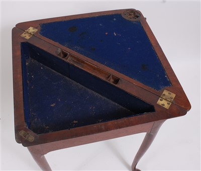 Lot 1474 - A George II walnut corner writing table, the...