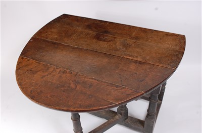 Lot 1476 - A circa 1700 joined oak dropleaf table, having...