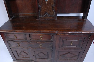 Lot 1498 - An antique oak house-keepers dresser, the...