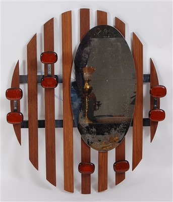 Lot 462 - A 1970s combination wall mounted mirrorback...