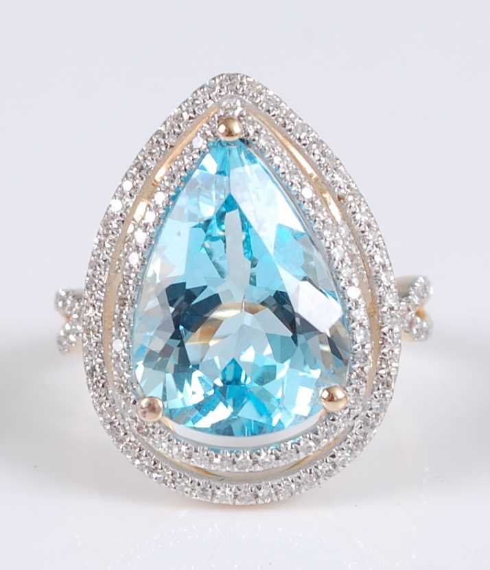 Lot 1214 - A yellow metal pear shaped blue topaz and...