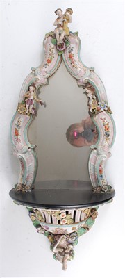 Lot 1005 - A 19th century German porcelain wall mirror,...