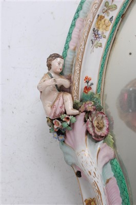 Lot 1006 - A 19th century German porcelain wall mirror,...