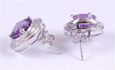Lot 1216 - A pair of white metal, amethyst and diamond...