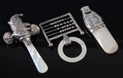 Lot 1156 - A small George V silver baby's rattle,...