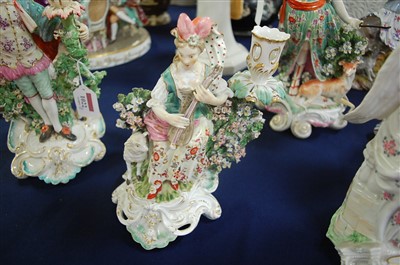 Lot 1022 - A Derby porcelain bocage candle-holder figure...