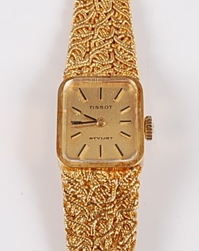 Lot 1251 - An 18ct yellow gold lady's Tissot manual wind...