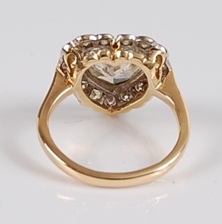 Lot 1226 - An 18ct yellow and white gold heart shaped...
