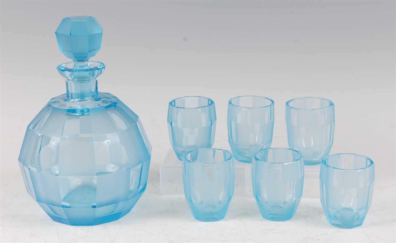 Lot 208 - An Art Deco blue glass decanter set, of...