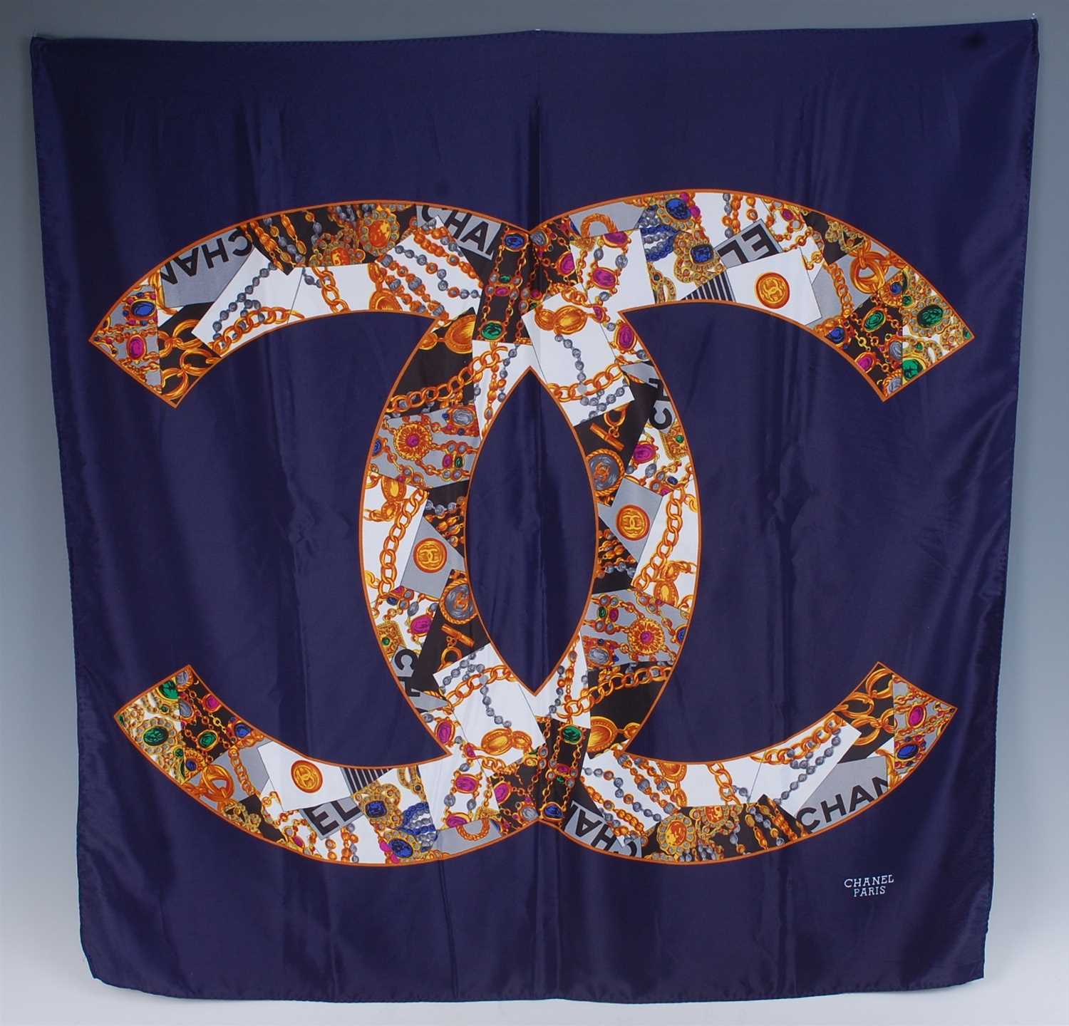 Lot 268 - A Chanel silk scarf, with opposing CC chain...