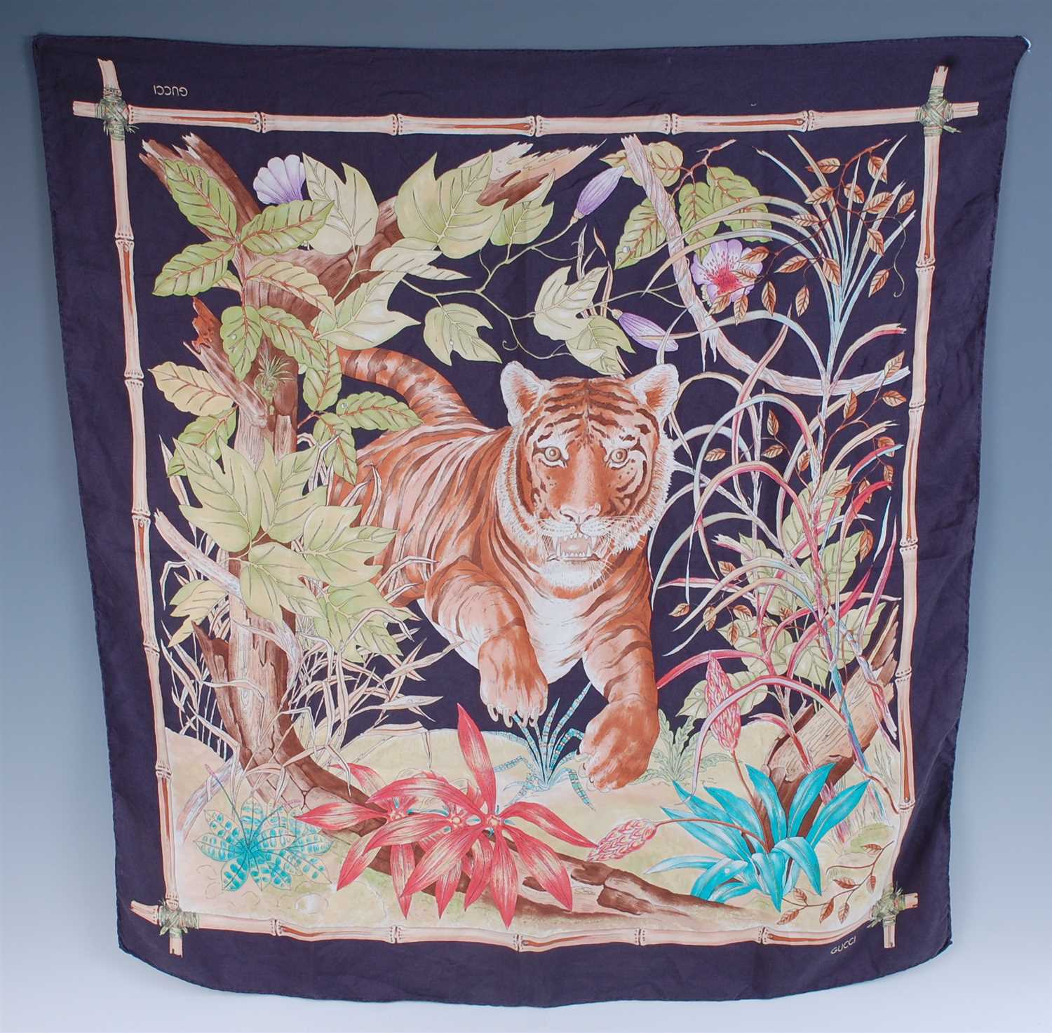 Lot 273 - A Gucci silk scarf, decorated with a tiger...