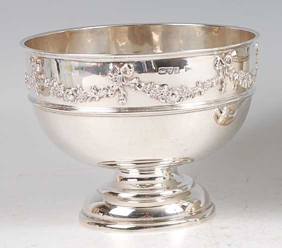 Lot 1164 - An Edwardian silver pedestal rose bowl, the...