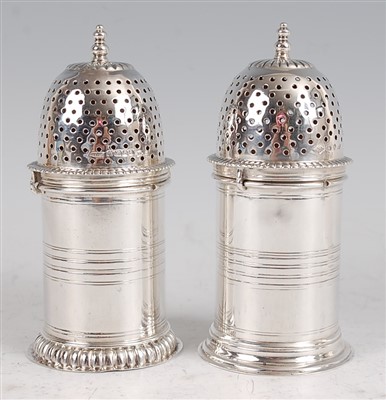 Lot 1167 - A matched pair of late Victorian silver sugar...