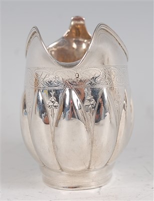 Lot 1095 - A George IV silver cream jug, of helmet form,...