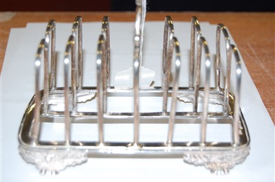 Lot 1107 - A George IV silver six division toast rack,...