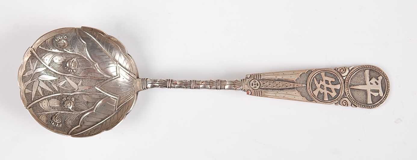 Lot 1322 - A Japanese Meiji period white metal spoon, the...