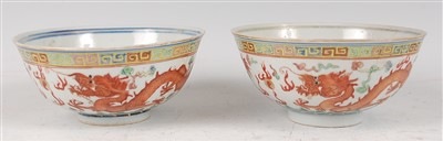 Lot 1336 - A pair of Chinese porcelain dragon bowls, each...