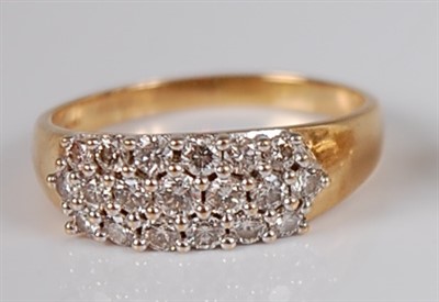 Lot 1200 - A contemporary 18ct gold diamond dress ring,...