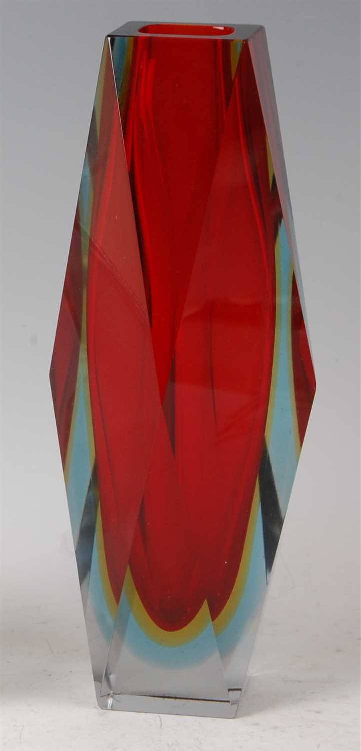 Lot 204 - A 1960s Murano red cased glass faceted vase,...