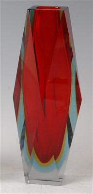Lot 204 - A 1960s Murano red cased glass faceted vase,...
