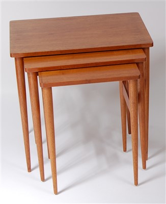 Lot 489 - A 1960s teak nest of three occasional tables,...