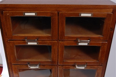 Lot 428 - An Art Deco oak narrow haberdashery cabinet,...
