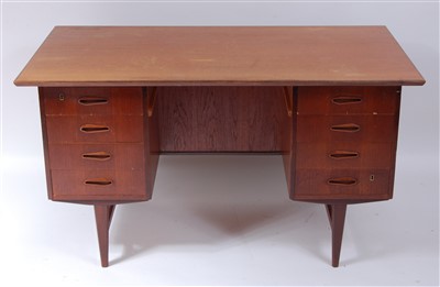 Lot 457 - A 1960s Danish teak kneehole writing desk, of...