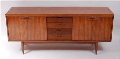 Lot 470 - A 1960s teak sideboard, having four reeded...