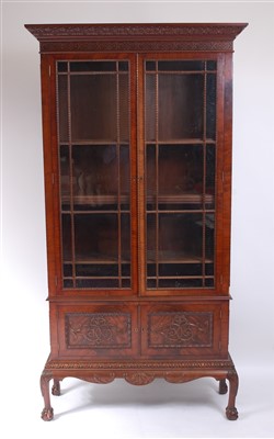 Lot 1113 - A circa 1900 mahogany bookcase on stand, the...