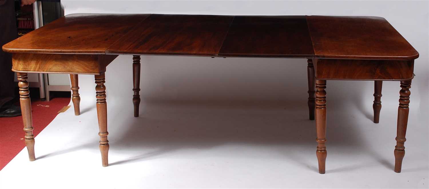 Lot 1455 - A Regency mahogany dining table, the D-ends...