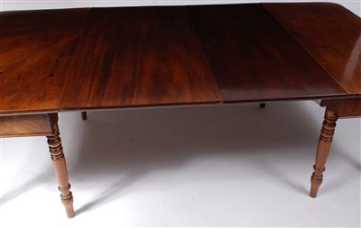 Lot 1455 - A Regency mahogany dining table, the D-ends...