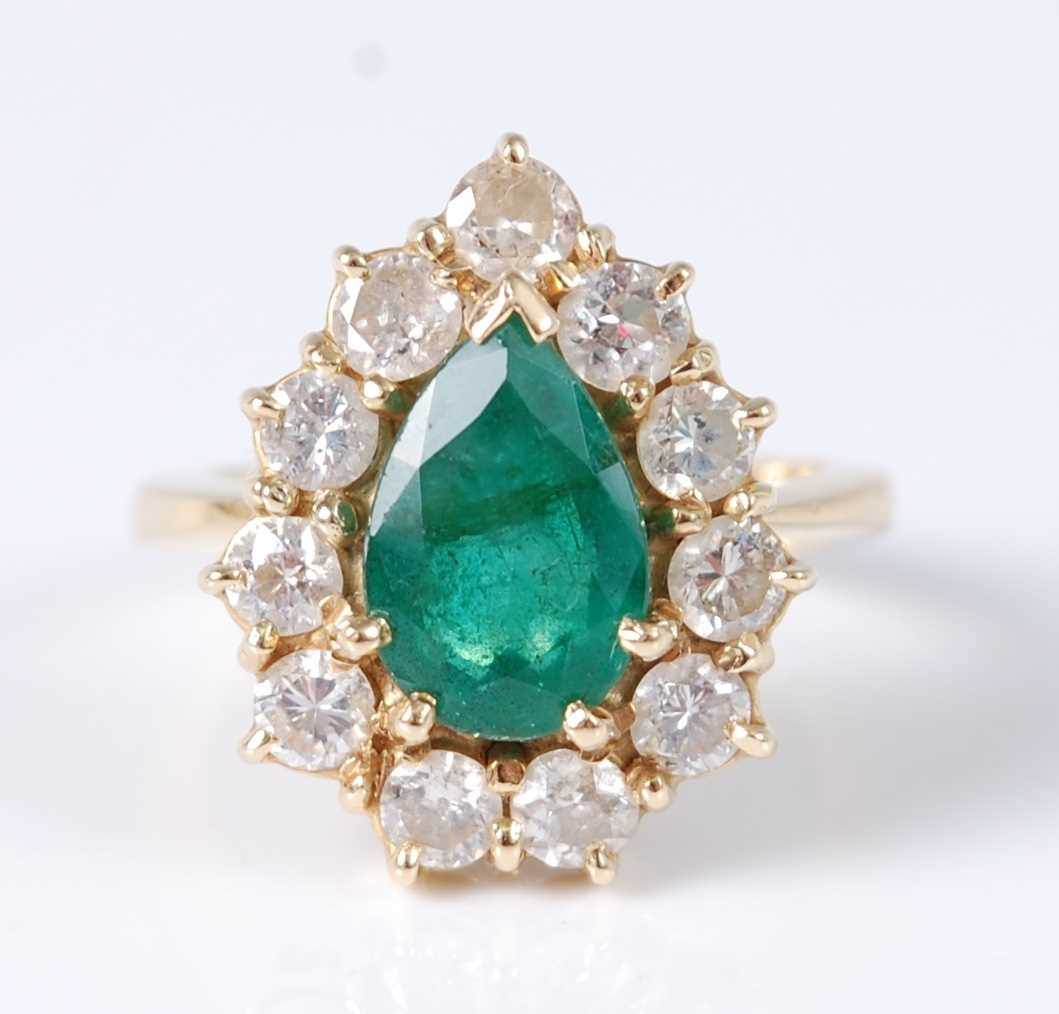 Lot 1225 - An 18ct yellow gold pear shaped emerald and...