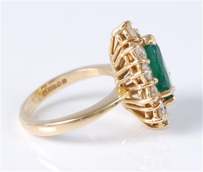 Lot 1225 - An 18ct yellow gold pear shaped emerald and...