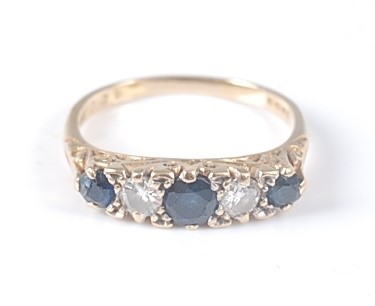 Lot 2606 - An 18ct yellow gold carved head sapphire and...