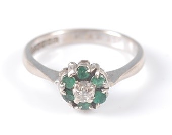 Lot 2564 - An 18ct white gold, emerald and diamond...