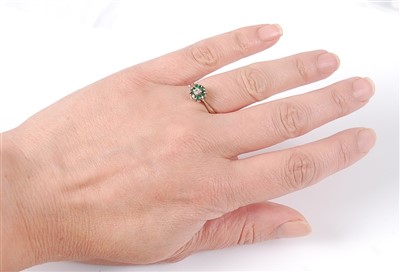 Lot 2564 - An 18ct white gold, emerald and diamond...