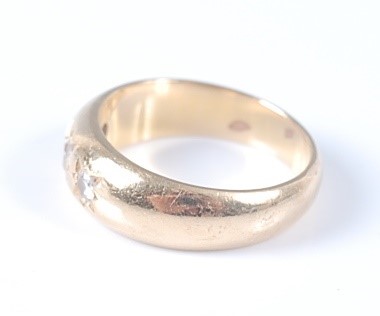 Lot 2630 - A yellow metal Gypsy set diamond dress ring,...